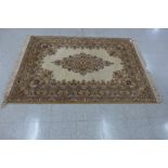 A beige ground rug, 199 x 142cms