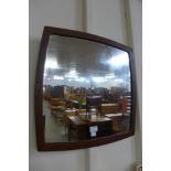 A teak framed mirror