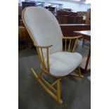 An Ercol Blonde beech and elm rocking chair