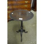 A mahogany tripod wine table