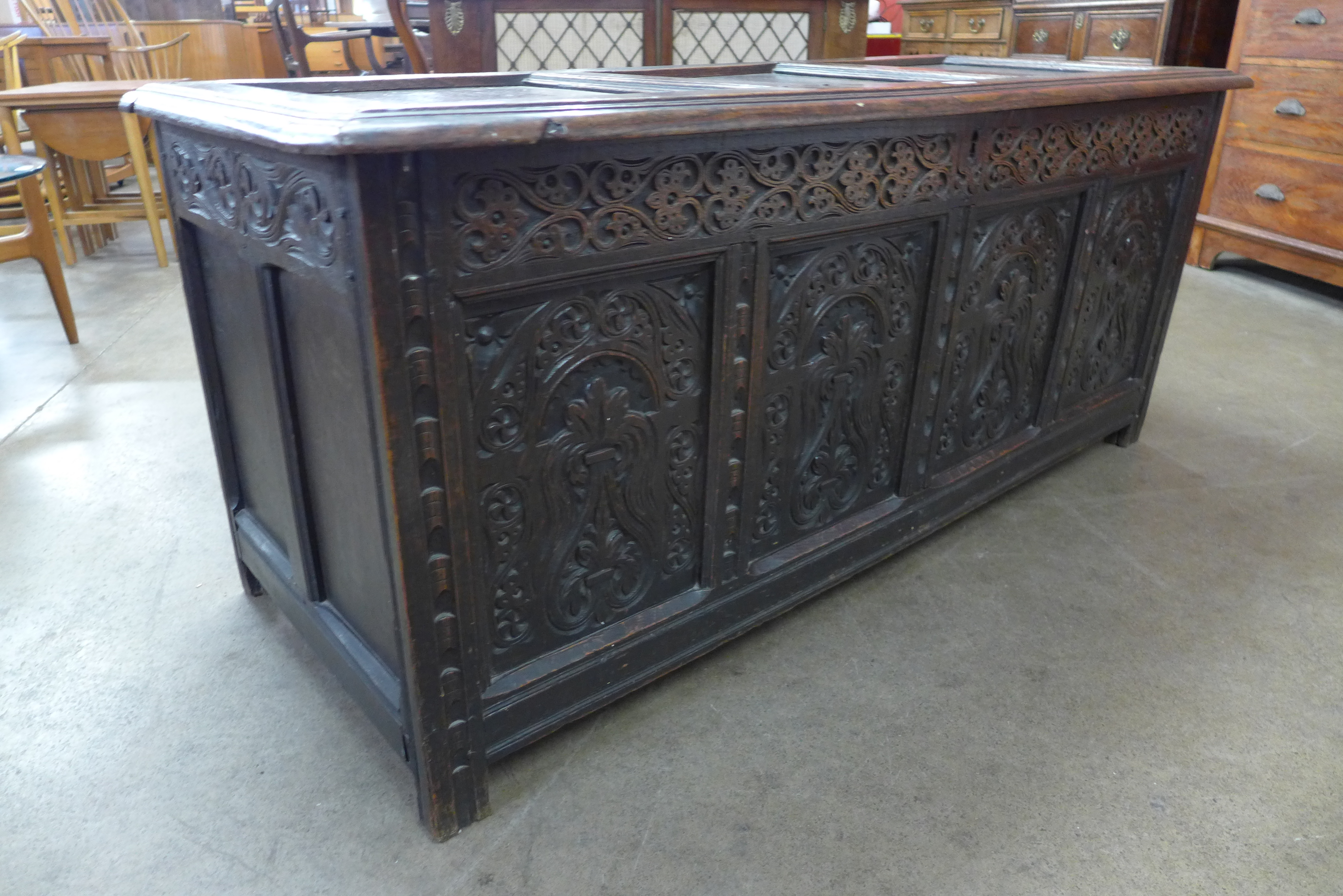 A Charles II carved panelled oak coffer