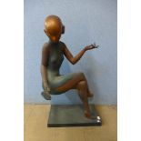 An Art Deco style bronze figure of a seated lady with mirror