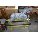 A painted dapple grey rocking horse