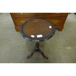 A mahogany tripod wine table