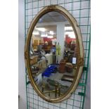 A cream and parcel gilt framed mirror
