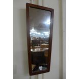 A teak framed mirror