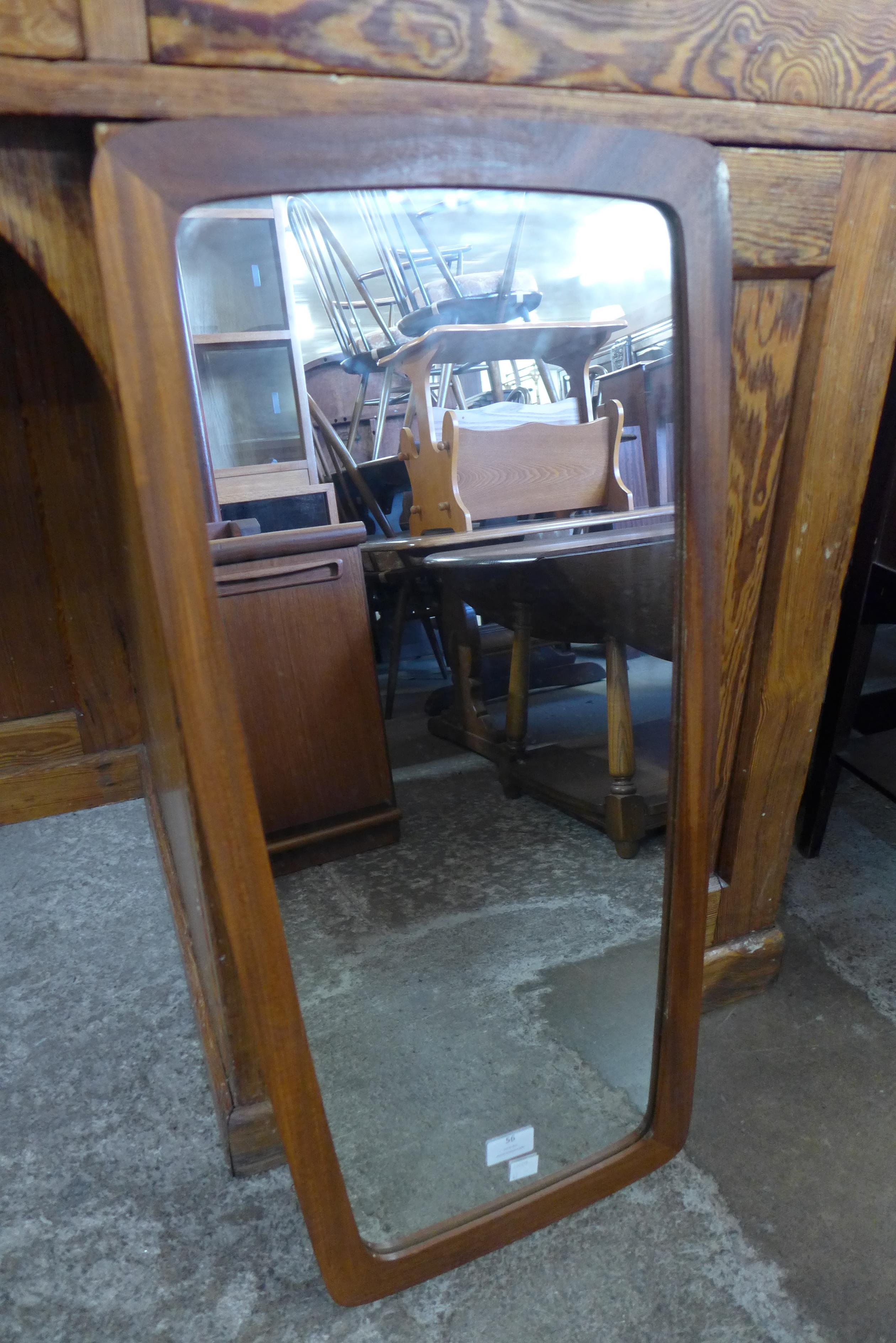 A teak framed mirror