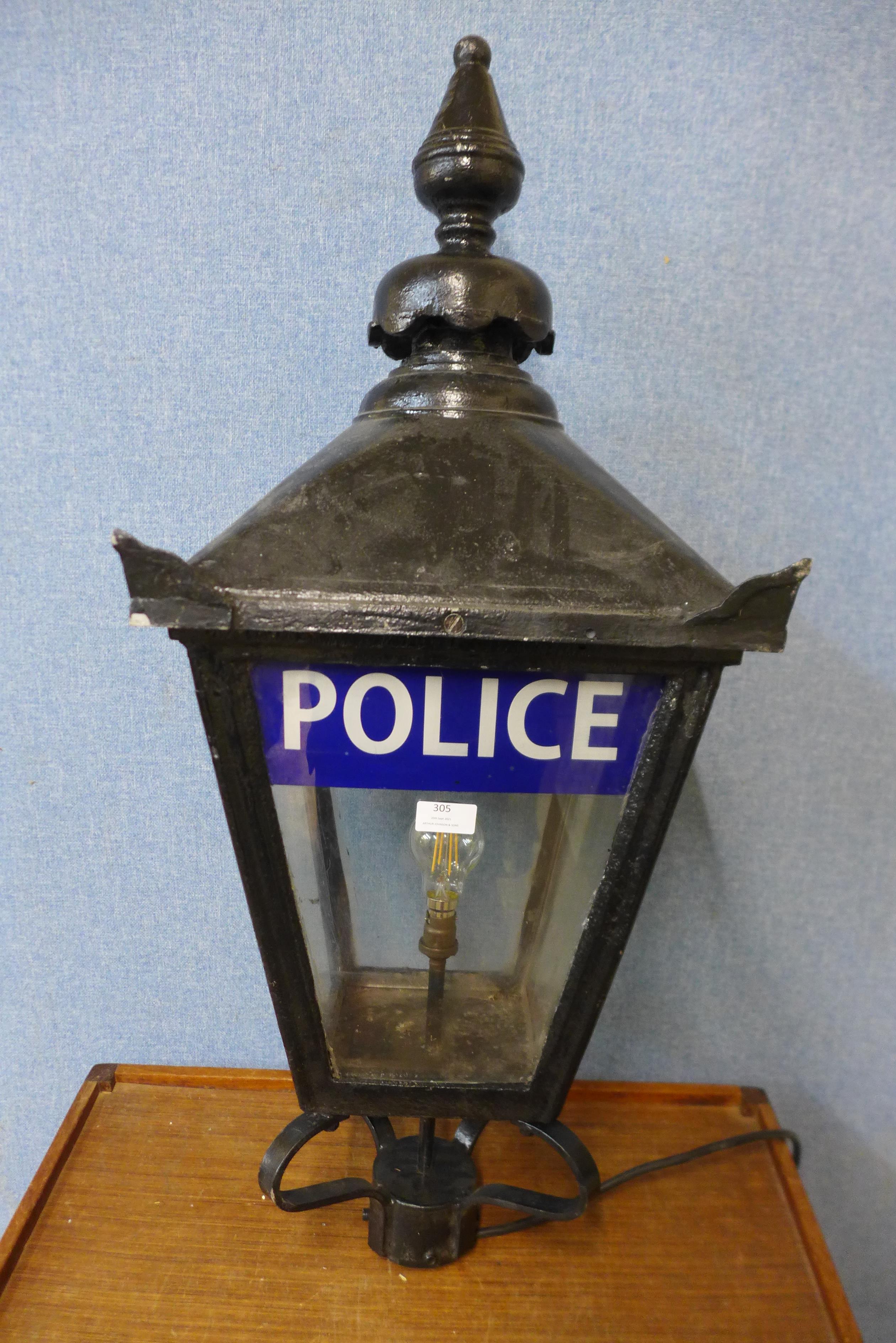 A cast iron lantern, bearing Police inscription to glass