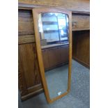 A teak framed mirror