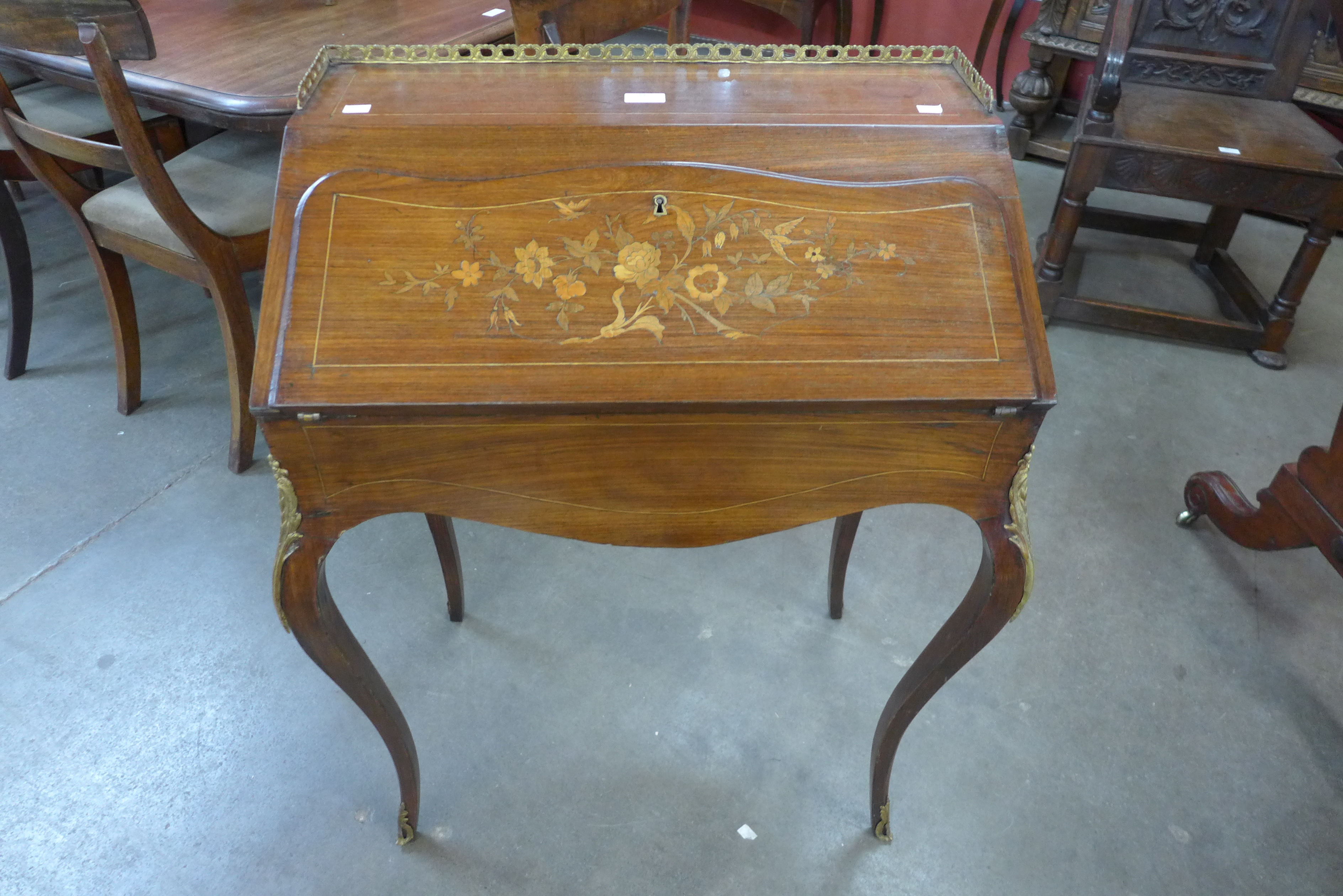 A 19th Century French marquetry inlaid rosewood and gilt metal mounted bureau de dame