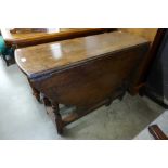 A George II oak single drawer gateleg table