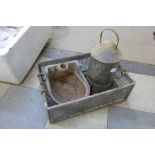 Two animal feeders and a galvanized basket