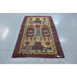 A small eastern beige ground rug, 140 x 89cms