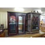 Two small glazed wall mounted display cabinets