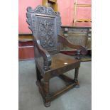 A 17th Century style carved oak Wainscot chair