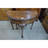 A George I mahogany demi-lune tea table