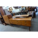 A teak dressing table and a chest of drawers