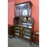 An Art Nouveau inlaid mahogany side cabinet, 207cms h, 122cms w, 41cms d