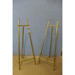 A pair of brass easels, 108cms h