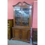 A George III style inlaid mahogany astragal glazed bookcase