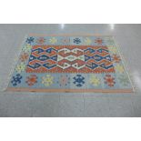 An eastern multi coloured hand knotted rug, 170 x 116cms