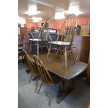 An Ercol Golden Dawn elm and beech refectory table and six chairs