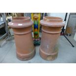 A pair of terracotta chimney pots