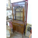 An Edward VII inlaid mahogany bookcase