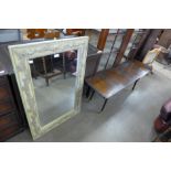 A mid 20th Century ply wood coffee table and a mirror