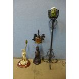 Two figural table lamps and a candle stand