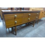 A teak four drawer sideboard