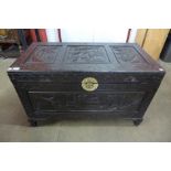 An oriental carved camphorwood blanket box