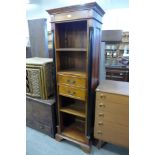 A slim hardwood open bookcase