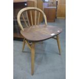 An Ercol elm and beech stool