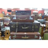 Three early 20th Century leather suitcases and one other