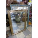 A green and parcel gilt framed mirror and another