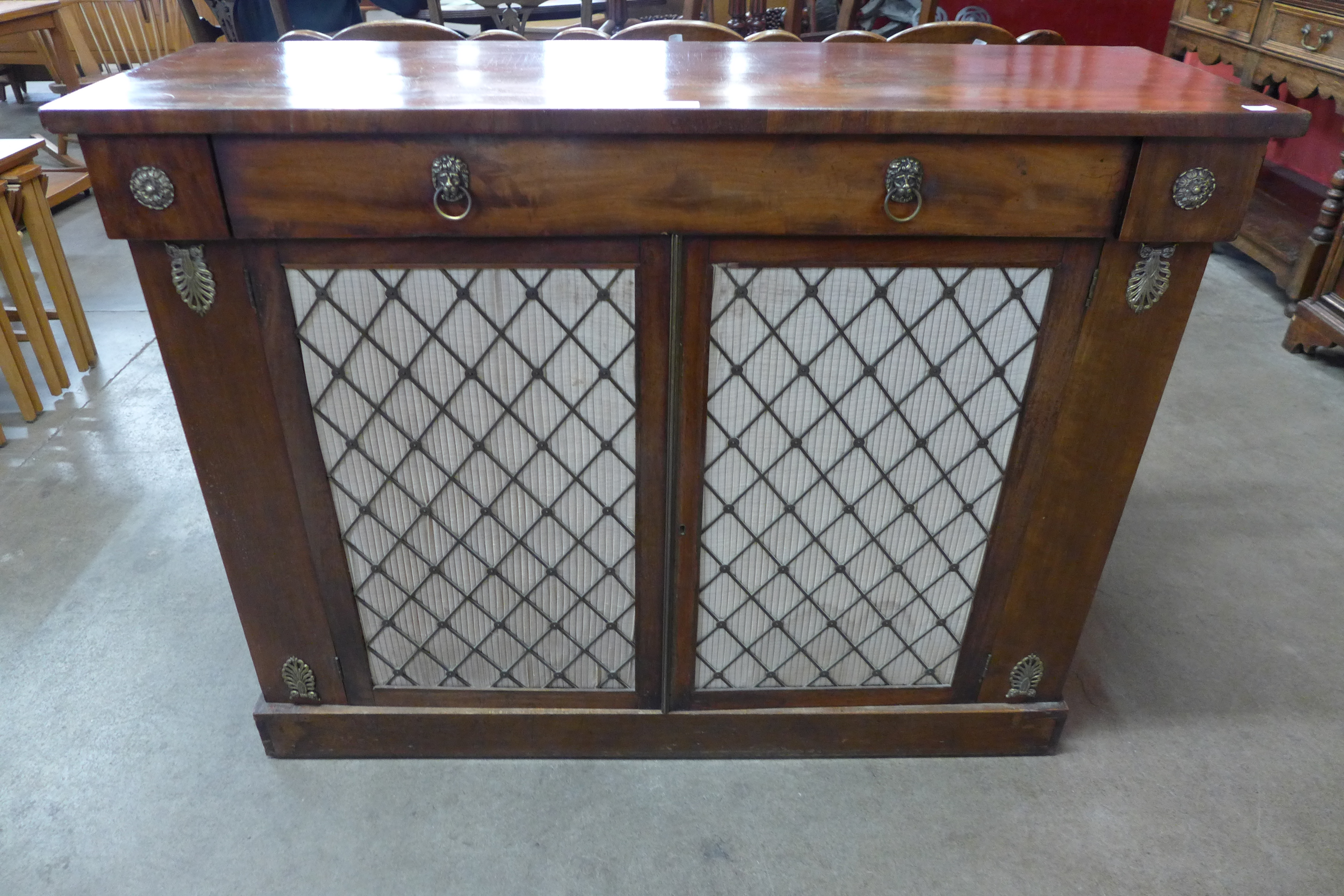 A Regency mahogany and gilt metal mounted side cabinet