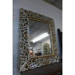A carved gilt wood mirror
