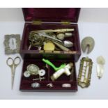 A jewellery box marked 'Boot's Fancy Dept.' with silver rings, a mother of pearl parasol handle,