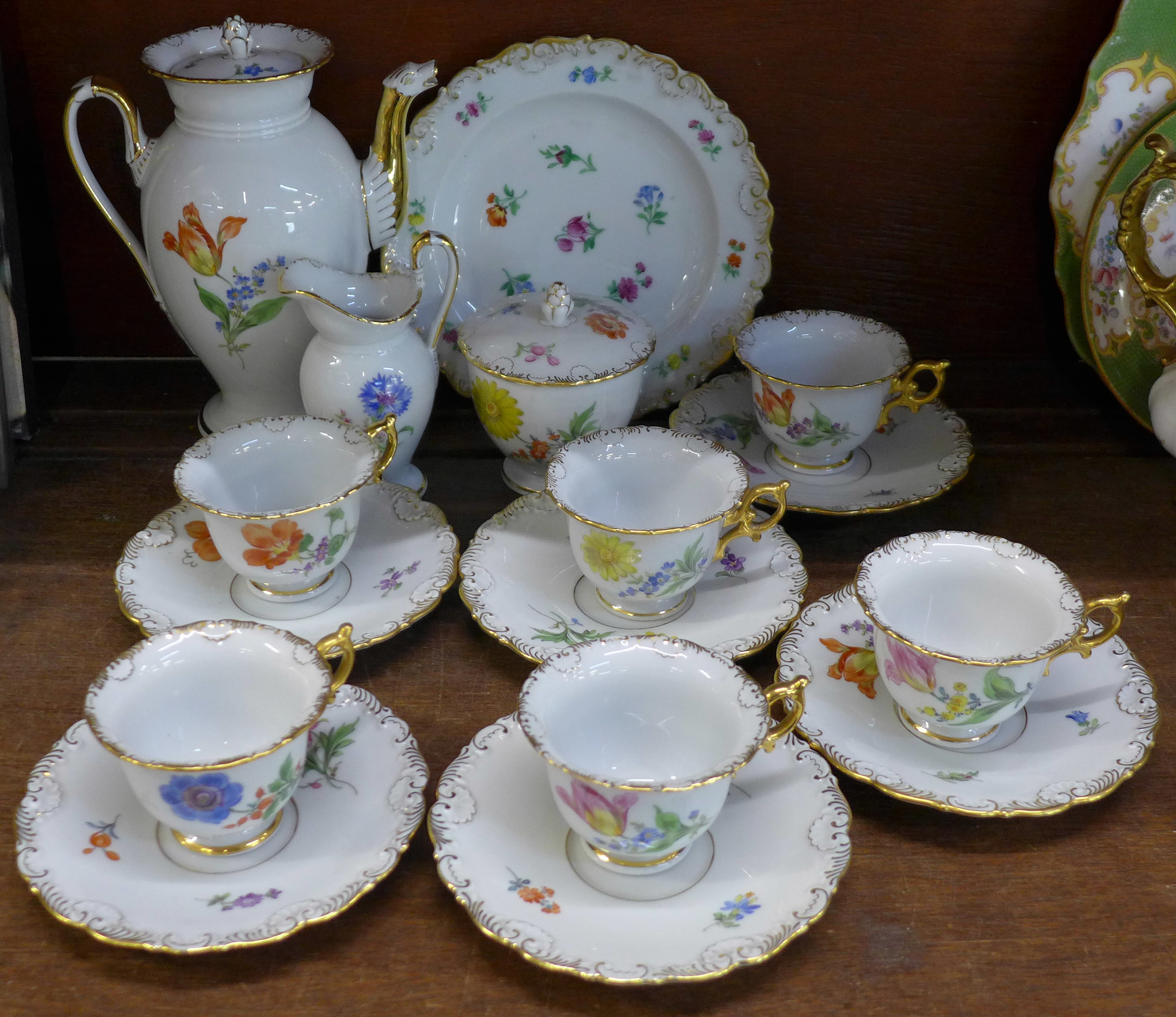 A Meissen flower six setting coffee service with coffee pot, cream, sugar and plate