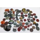 A collection of unmounted agate stones, etc.