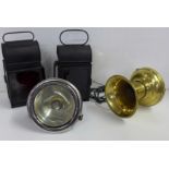 Two signal lamps, a car or motorcycle lamp and a brass car hooter