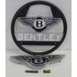 Two reproduction Bentley plaques, a Jaguar pin badge and a Land Rover brass fob