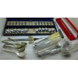 A case of plated spoons, other flatware and three letter openers