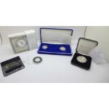 A Beatrix Potter Peter Rabbit silver proof 50p coin, a Sapphire Jubilee silver proof £5 coin, two of