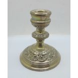 A silver candlestick, marked 'filled'