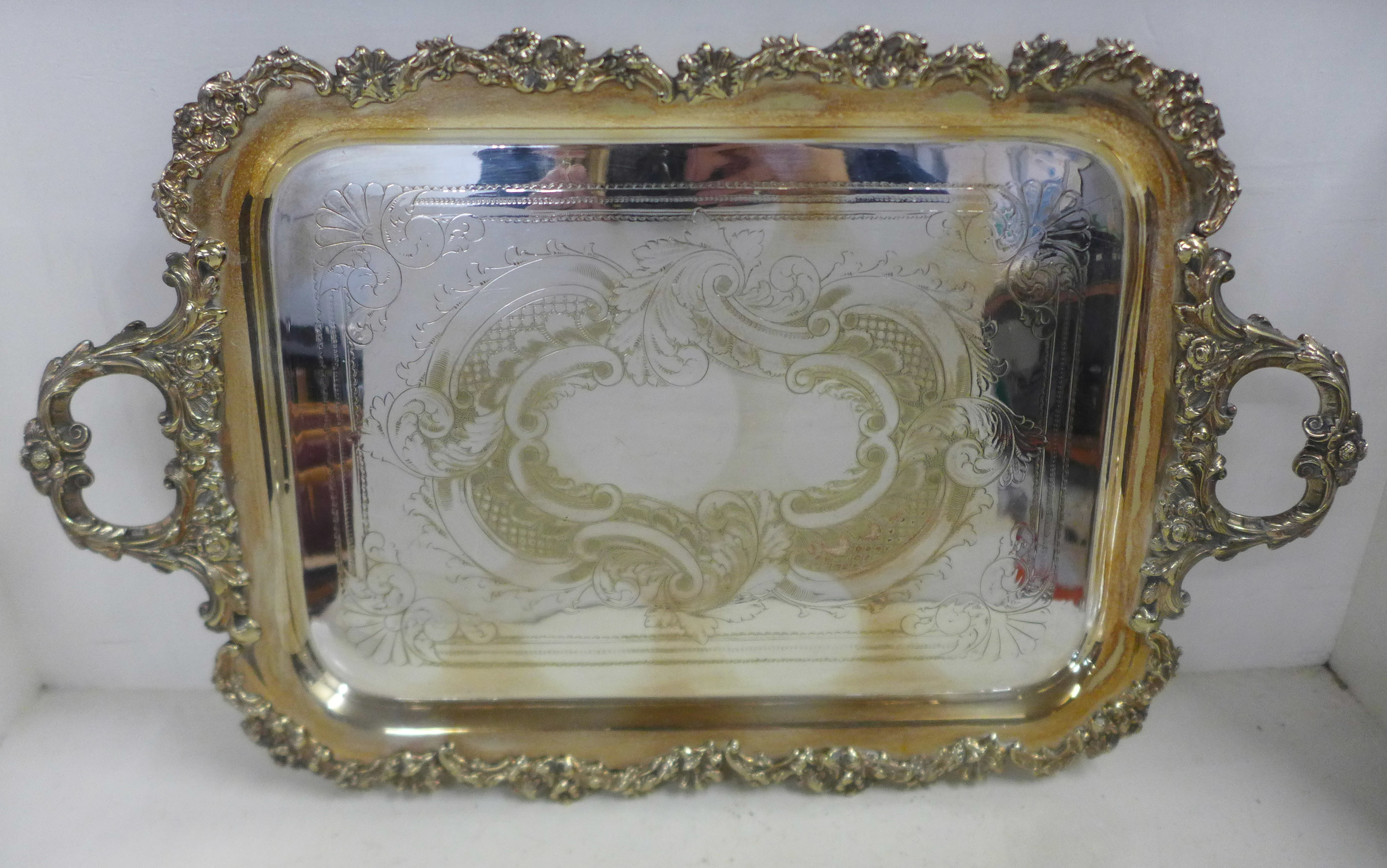 A large silver plated two handled tray with cast metal edge, 51cm