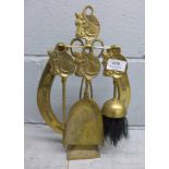 A brass five piece fireplace horse shoe companion set **PLEASE NOTE THIS LOT IS NOT ELIGIBLE FOR
