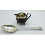 A George III silver spoon by George Smith III, London 1785 and a Victorian white metal mounted