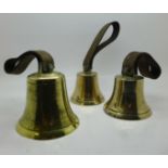 Three brass hand bells